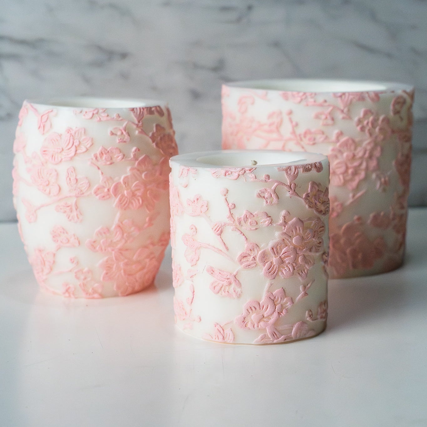 Divine cherry blossom inspired long burning candles scented with sweet pea and peony
